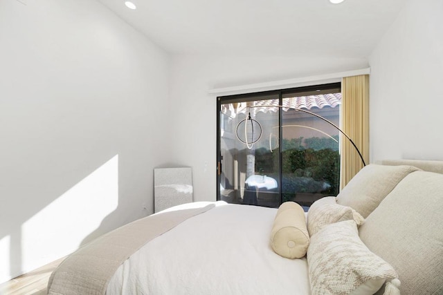 bedroom with hardwood / wood-style floors