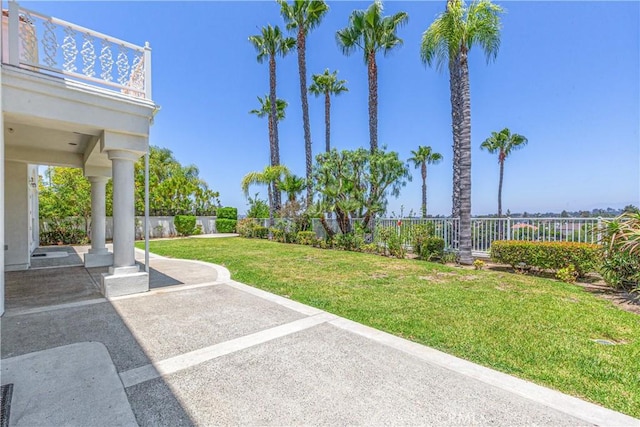 view of yard featuring a patio area and a balcony