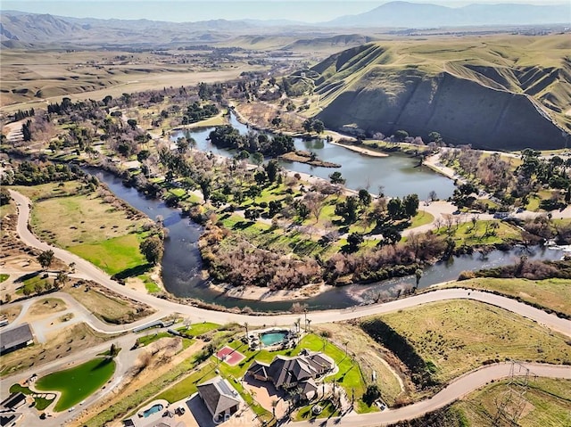 bird's eye view featuring a water and mountain view
