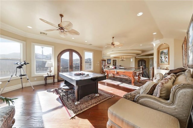 rec room featuring dark hardwood / wood-style flooring, crown molding, and french doors