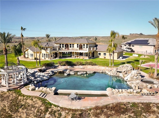 view of pool featuring a yard
