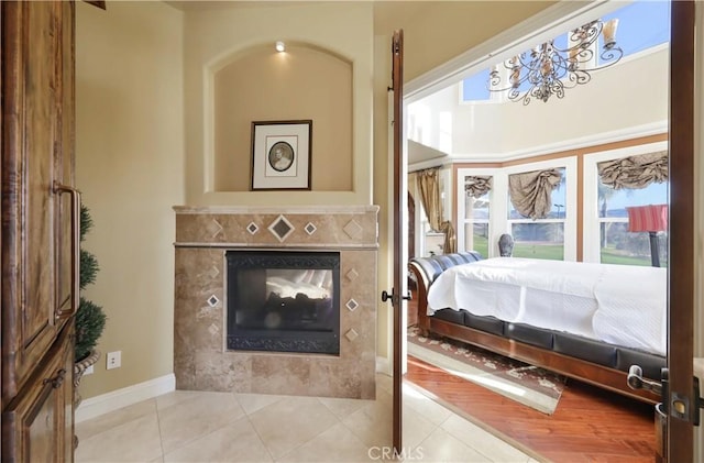 interior space featuring light tile patterned flooring and a fireplace