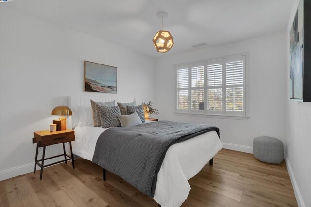 bedroom featuring light wood-type flooring