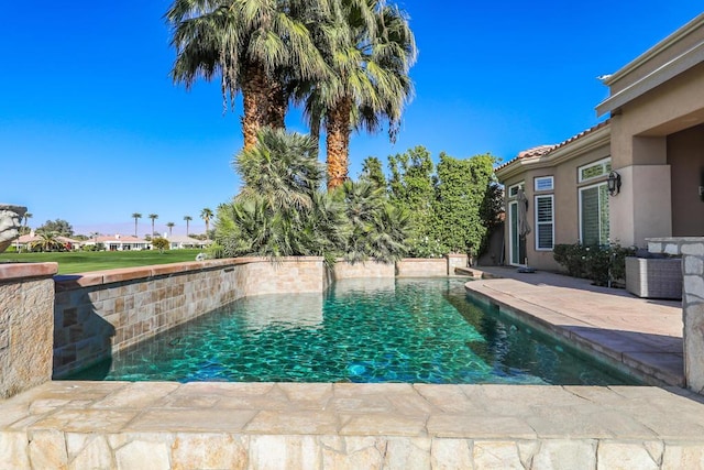 view of swimming pool with a patio area