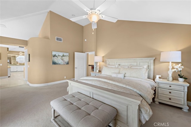 carpeted bedroom featuring ceiling fan and vaulted ceiling