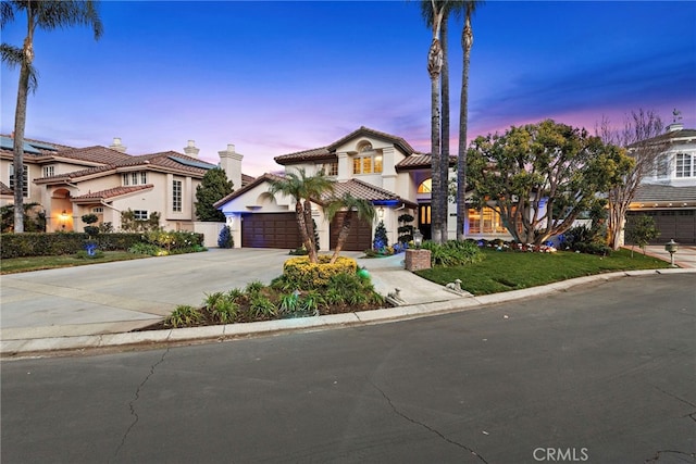 mediterranean / spanish house featuring a garage