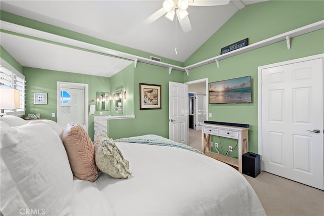 carpeted bedroom featuring ceiling fan and vaulted ceiling