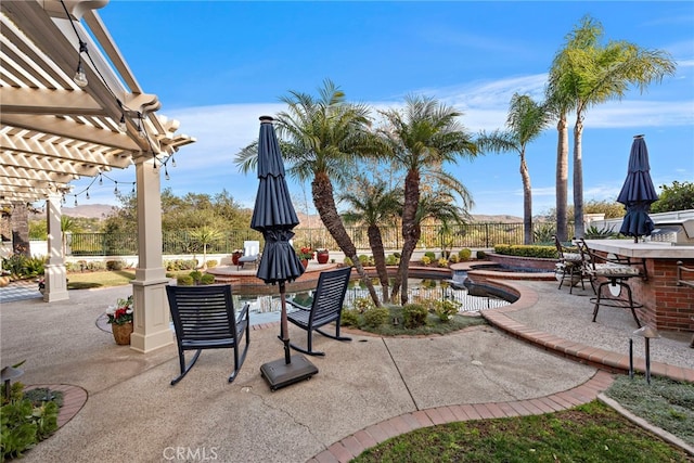 view of patio / terrace featuring a bar and a pergola