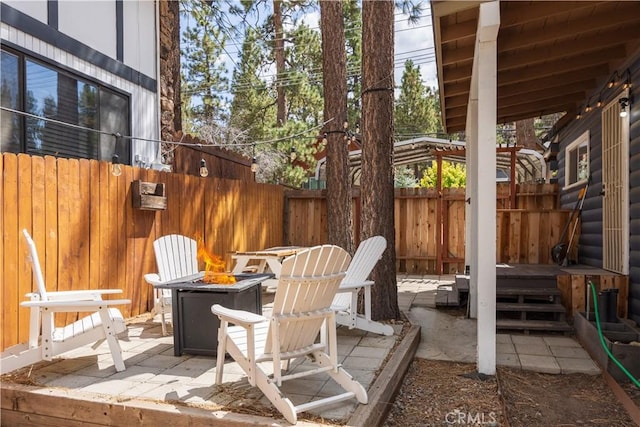 view of patio with a fire pit