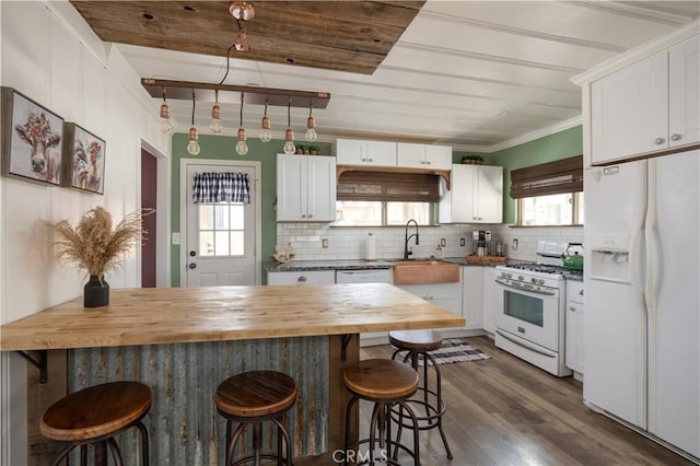 kitchen with white cabinetry, wooden counters, white appliances, dark wood-type flooring, and a breakfast bar