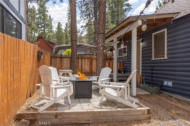 view of patio / terrace with a fire pit