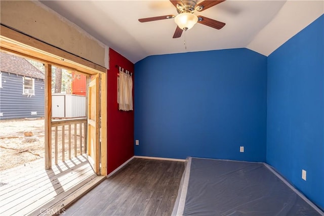 interior space featuring ceiling fan, hardwood / wood-style floors, and vaulted ceiling