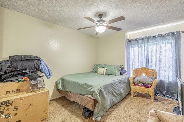 carpeted bedroom featuring a textured ceiling and ceiling fan