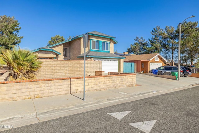 view of front of home featuring a garage