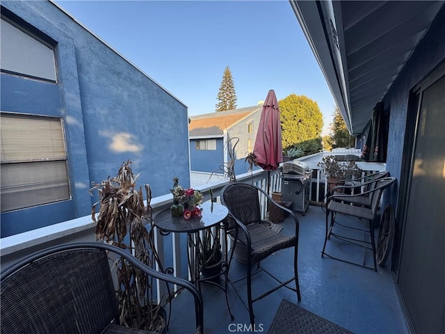 view of patio / terrace with a balcony and area for grilling