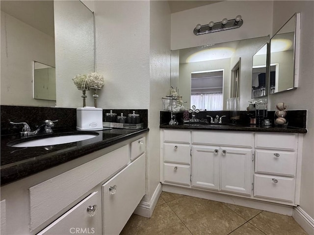 bathroom with tile patterned floors and vanity