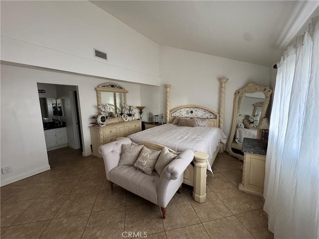 bedroom with light tile patterned flooring and high vaulted ceiling