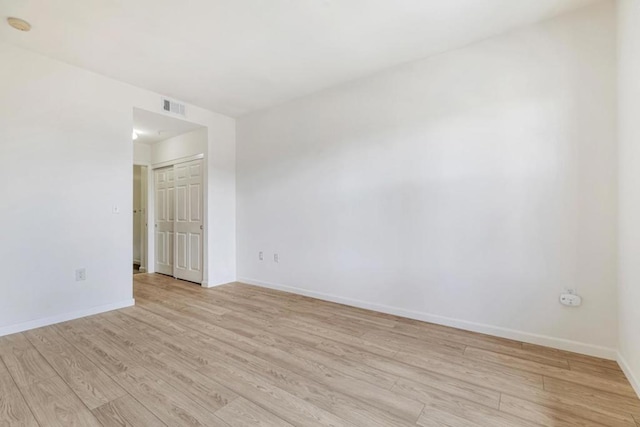 unfurnished room featuring light wood-type flooring