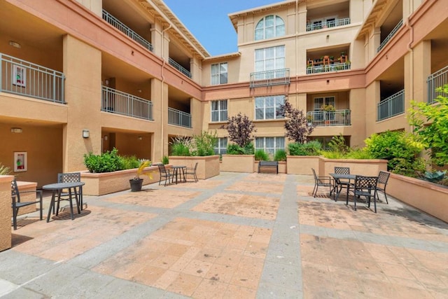 view of property's community with a patio area