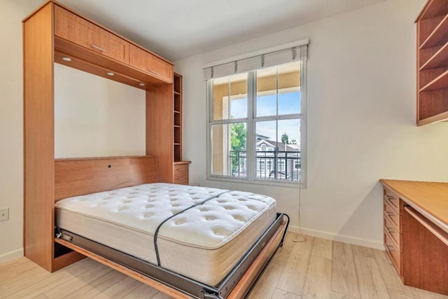 bedroom with light wood-type flooring