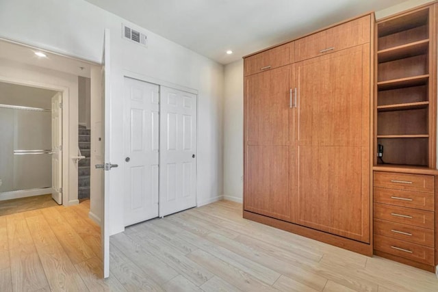 unfurnished bedroom with light hardwood / wood-style flooring