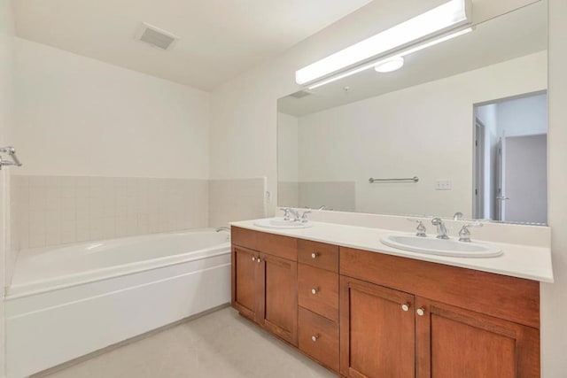 bathroom featuring a bathing tub and vanity