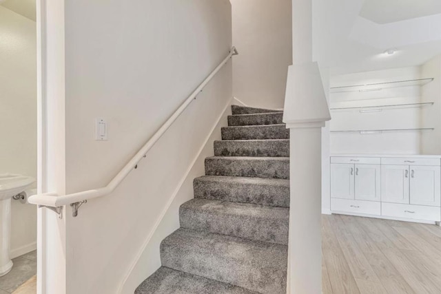 stairway with hardwood / wood-style floors