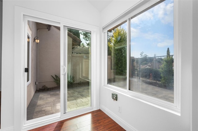 entryway with lofted ceiling and dark hardwood / wood-style floors