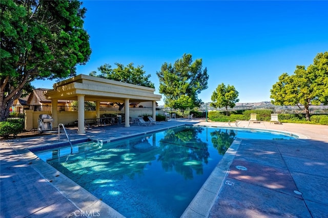 view of swimming pool featuring a gazebo and a patio