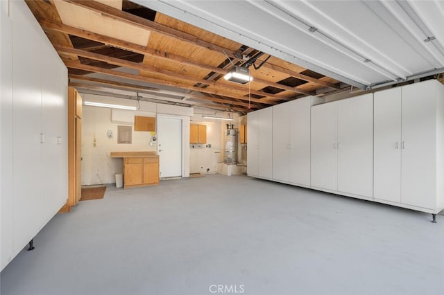 garage featuring a garage door opener and gas water heater