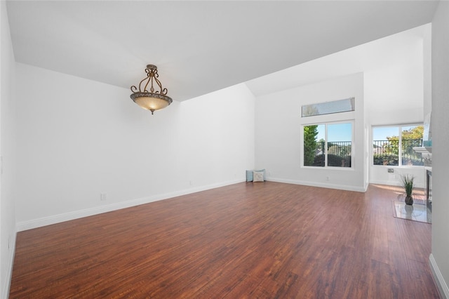 unfurnished living room featuring dark hardwood / wood-style floors