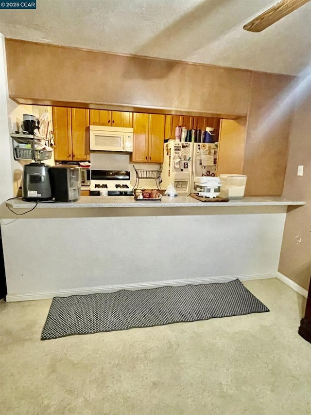 kitchen with ceiling fan and white appliances