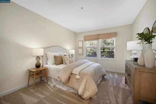 bedroom featuring light carpet