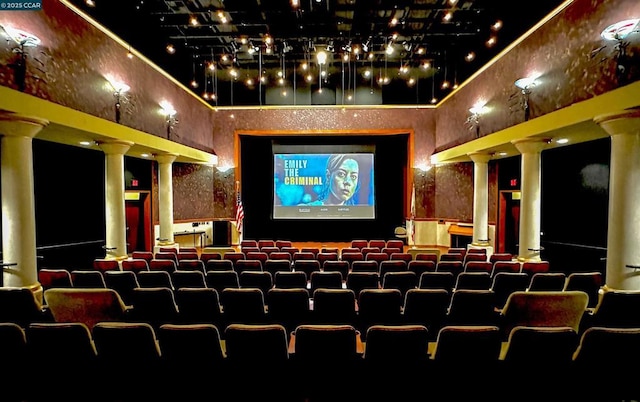 home theater room featuring ornate columns