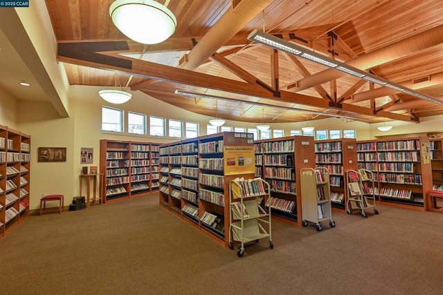 interior space with wooden ceiling, beamed ceiling, high vaulted ceiling, and carpet