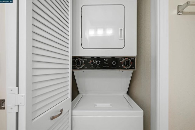 laundry room featuring stacked washing maching and dryer