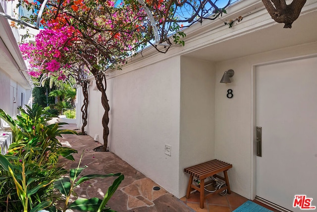 entrance to property with a patio area