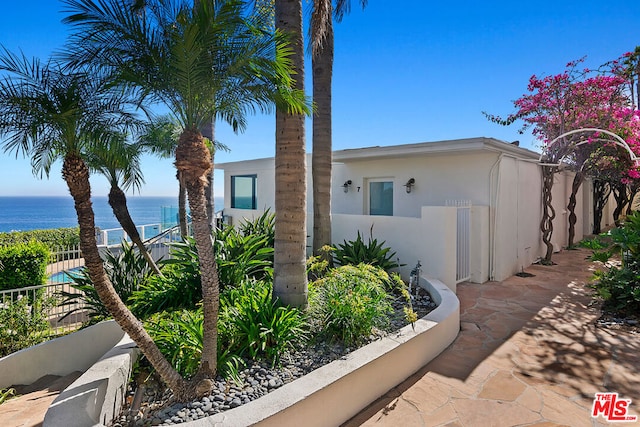 view of side of property with a water view