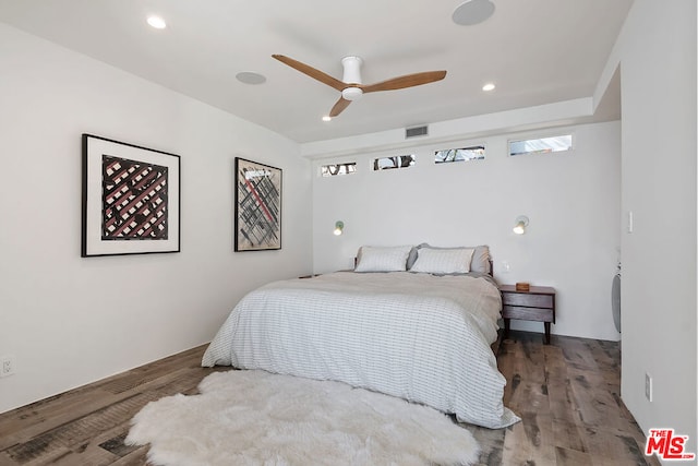 bedroom featuring ceiling fan and hardwood / wood-style flooring