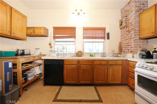 kitchen featuring white range oven, tile counters, and dishwasher