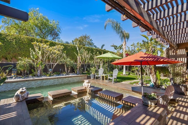 exterior space featuring a pergola and a deck