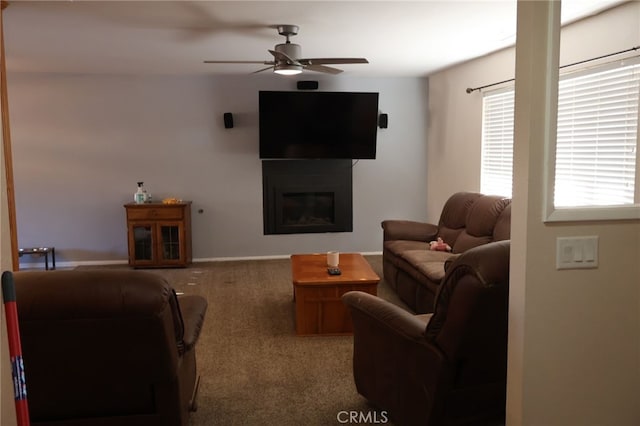 living room featuring ceiling fan and carpet flooring