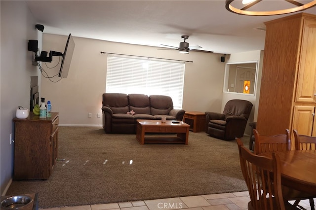 carpeted living room featuring ceiling fan