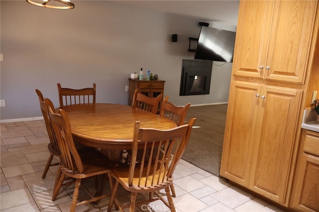 dining space featuring light tile patterned floors