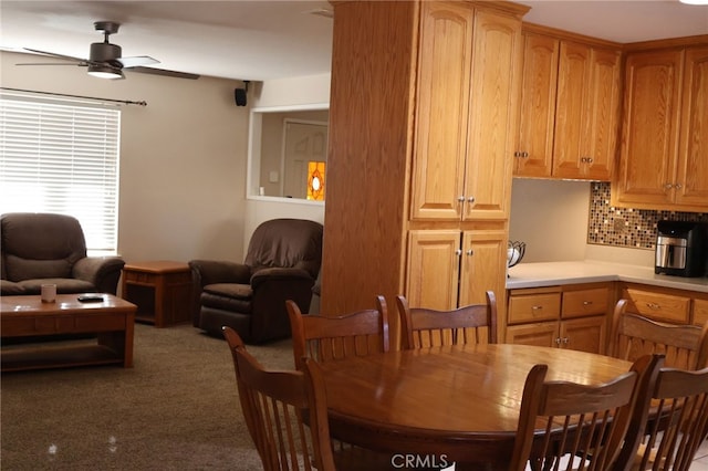 dining space featuring ceiling fan