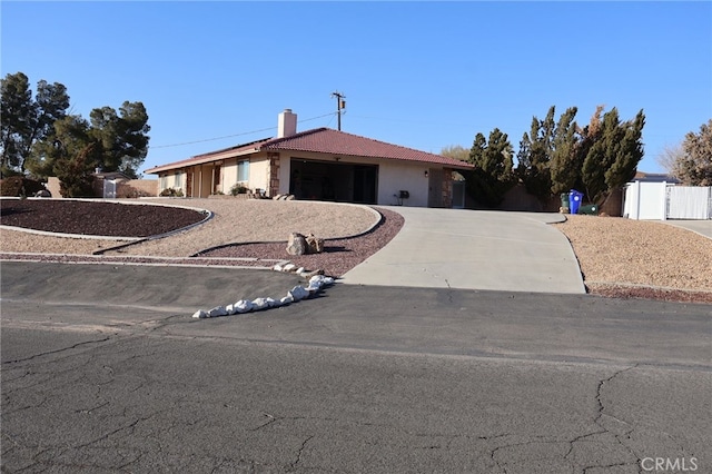 ranch-style house featuring a garage