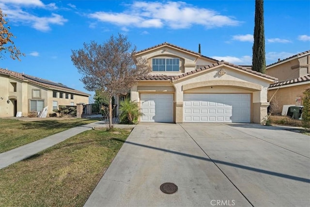 view of front of property featuring a garage and a front yard