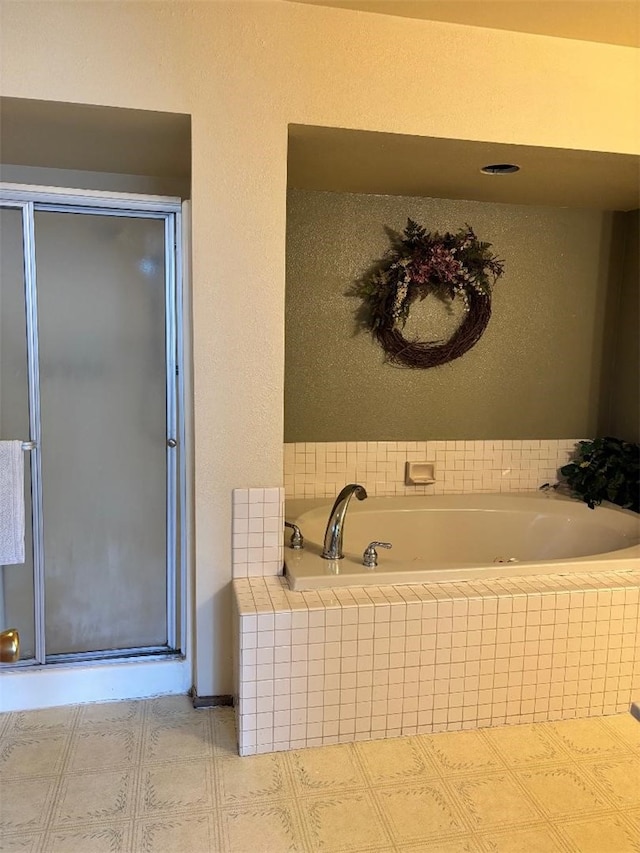 bathroom with separate shower and tub