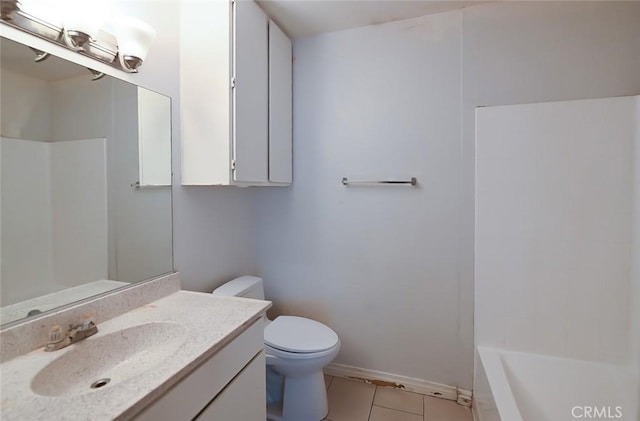 bathroom featuring tile patterned floors, vanity, and toilet