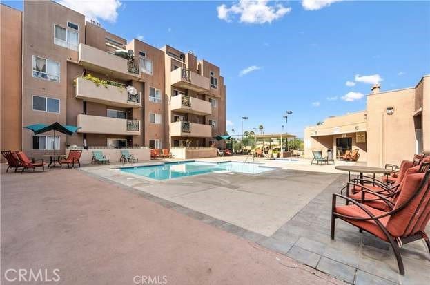 view of swimming pool with a patio area